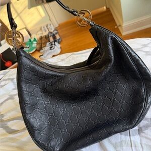 Gucci Black Embossed Hobo Bag with Gold Accents